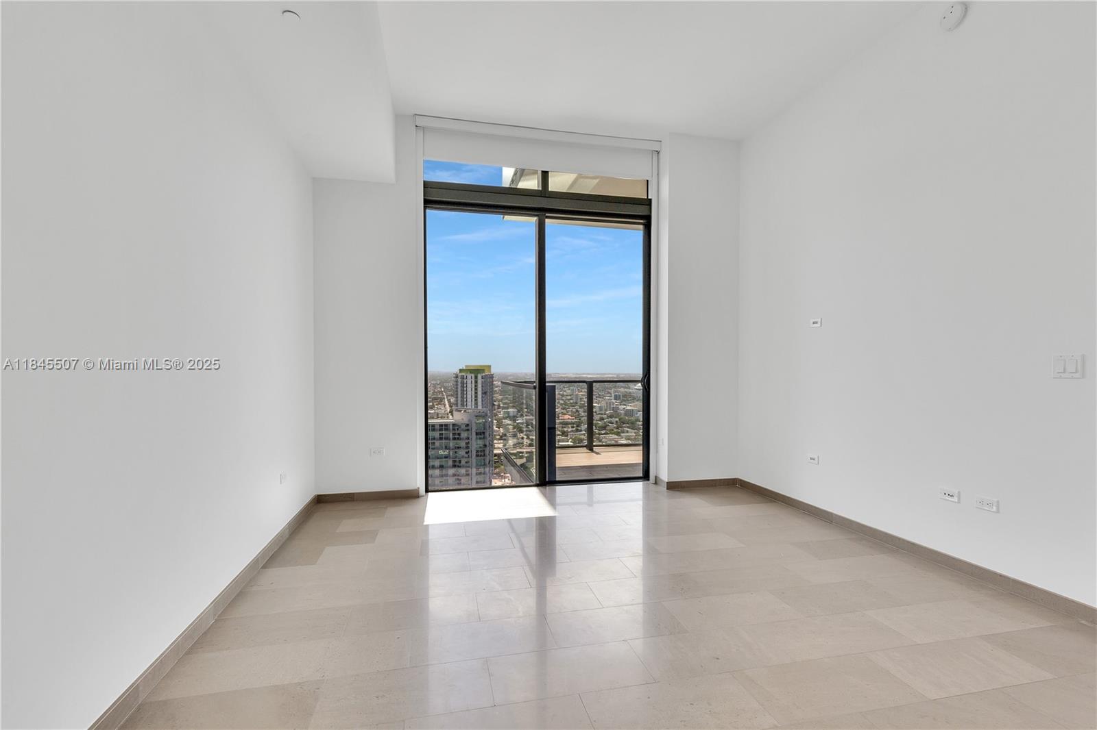 68 Southeast 6th Street, Unit 4110 Miami, FL 33131 - Photo 12 of 23 wooden floor in an empty room