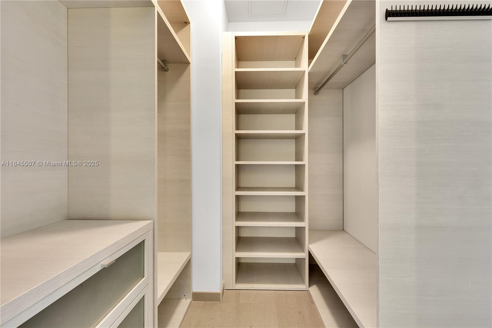 68 Southeast 6th Street, Unit 4110 Miami, FL 33131 - Photo 15 of 23 a view of walk in closet with empty racks