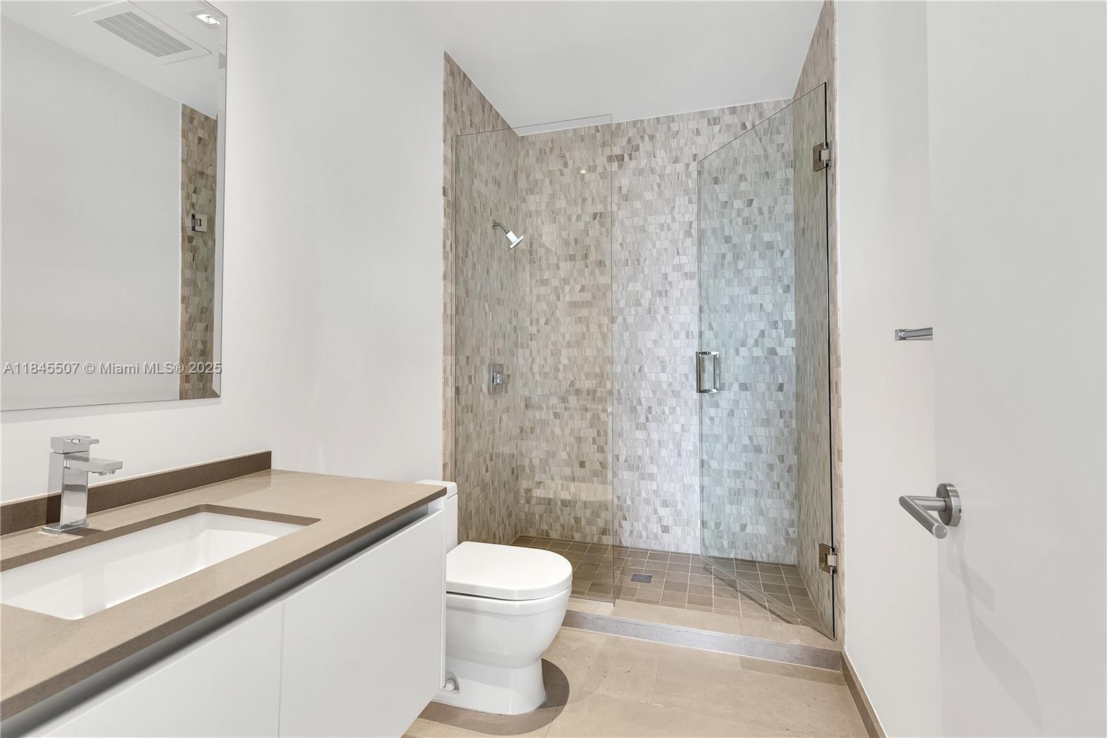 68 Southeast 6th Street, Unit 4110 Miami, FL 33131 - Photo 7 of 23 a bathroom with a sink a toilet and shower