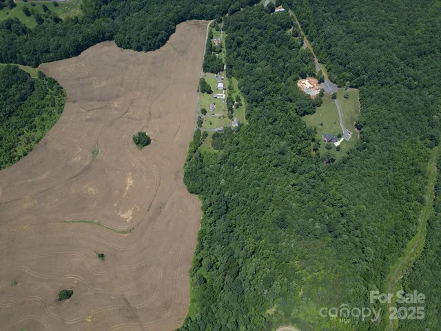 an aerial view of a house with outdoor space