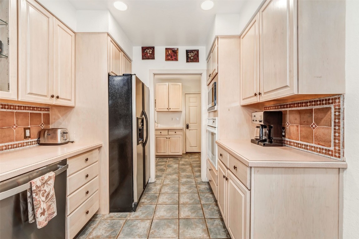 424 3rd Street Steamboat Springs, CO 80487 - Photo 12 of 48 a kitchen with stainless steel appliances granite countertop a refrigerator and a stove