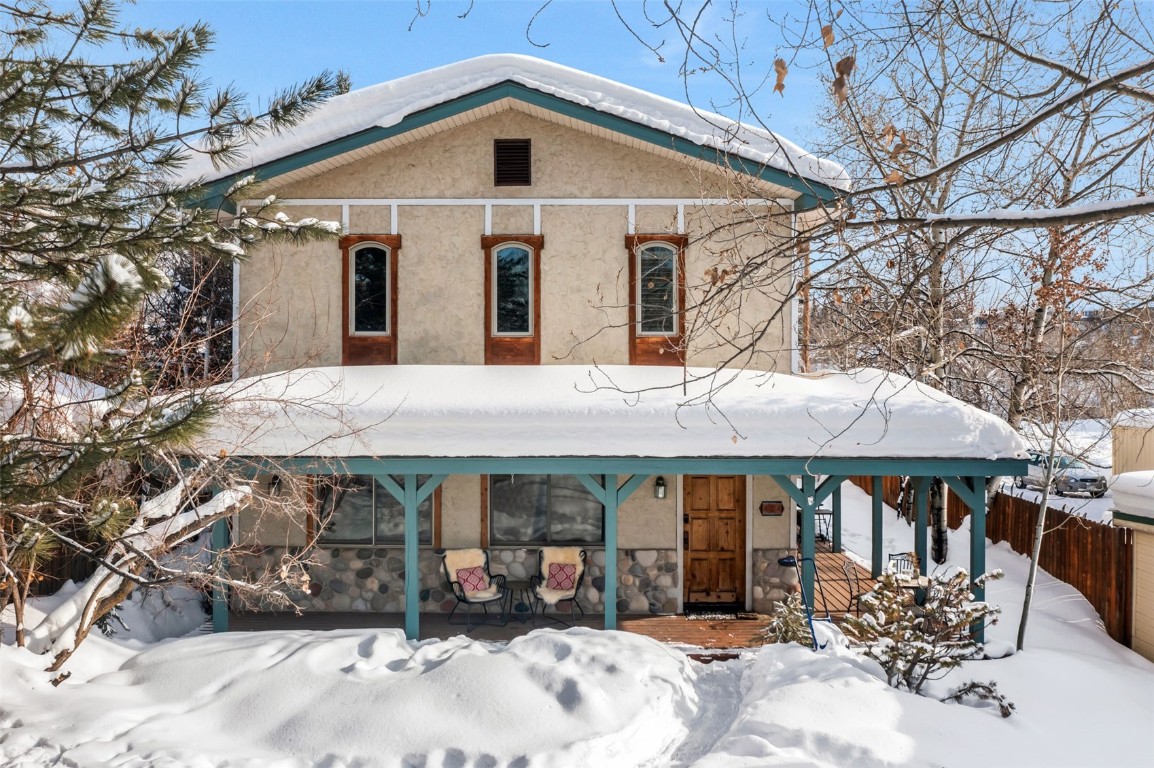 424 3rd Street Steamboat Springs, CO 80487 - Photo 45 of 48 a front view of a house with a yard and garage