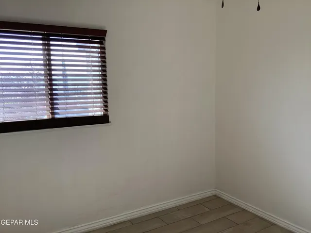 a view of a backyard of the house