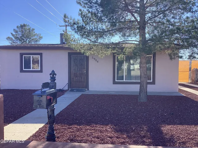 a house view with a backyard space
