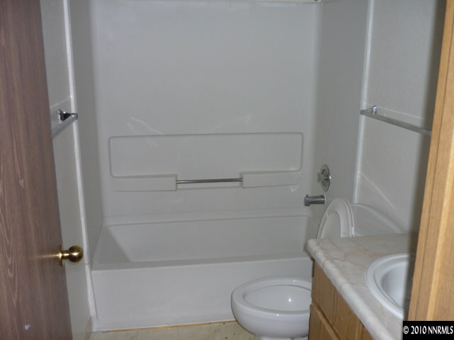 4170 Neil Road, Unit 15S Reno, NV 89502 - Photo 7 of 8 a bathroom with a sink and toilet