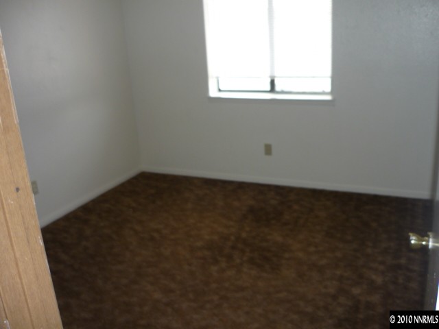 4170 Neil Road, Unit 15S Reno, NV 89502 - Photo 8 of 8 an empty room with a window