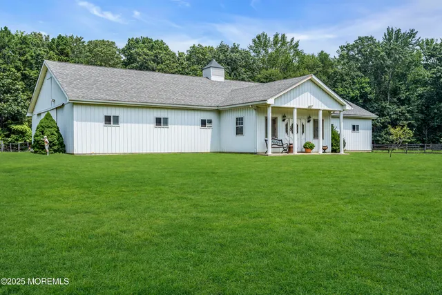 a view of house with a big yard