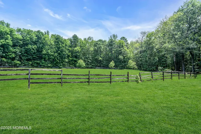 a view of a house with a big yard