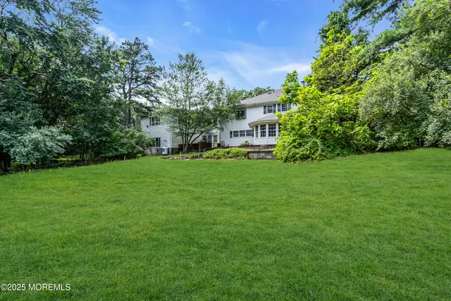a view of a house with a big yard