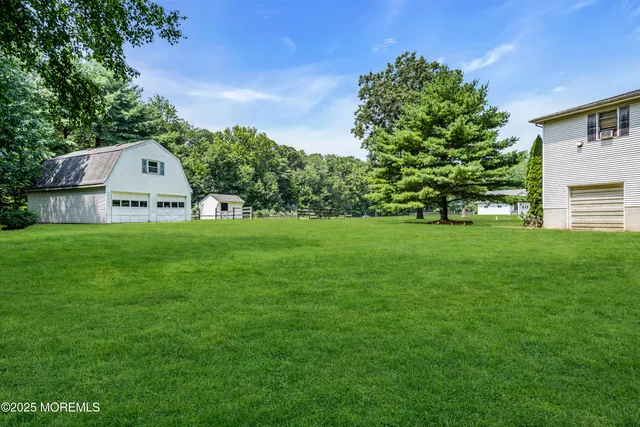 a view of a house with a big yard