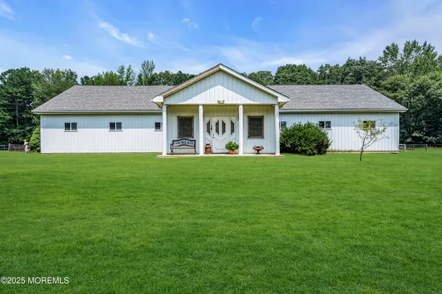 a front view of house with yard and green space