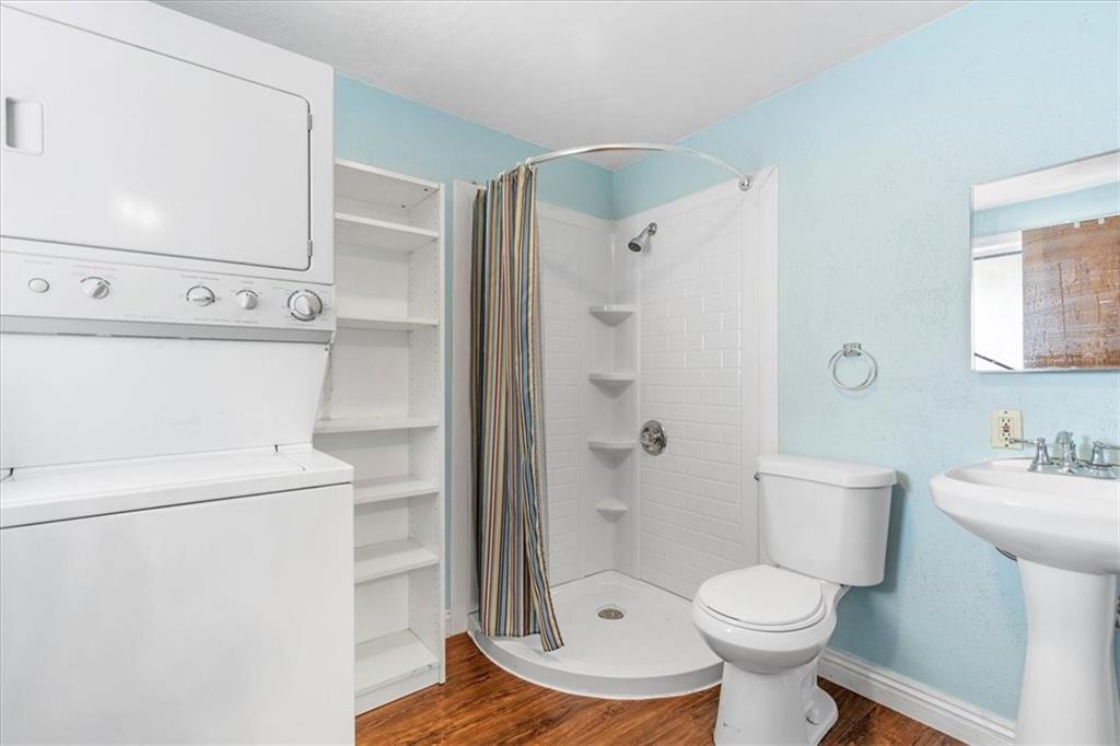 1622 Methyl Street Pittsburgh, PA 15216 - Photo 12 of 45 a bathroom with a toilet sink a shower and a mirror