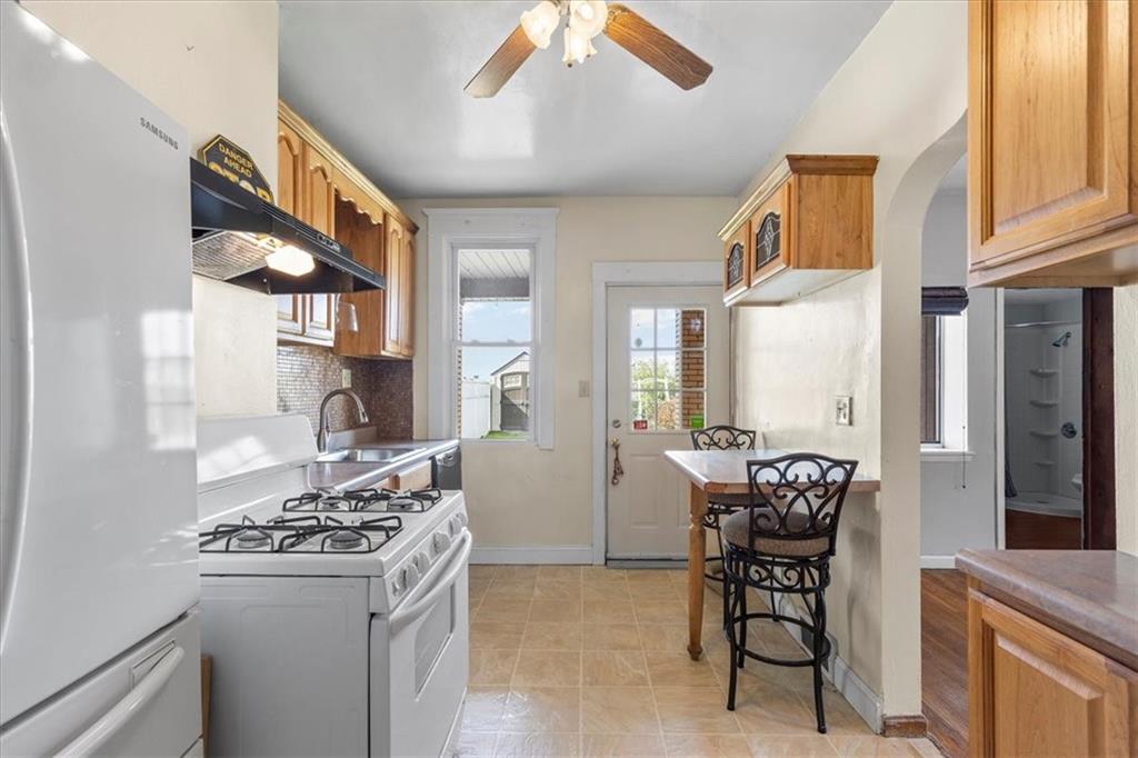 1622 Methyl Street Pittsburgh, PA 15216 - Photo 14 of 45 a kitchen with stainless steel appliances granite countertop a stove and a refrigerator