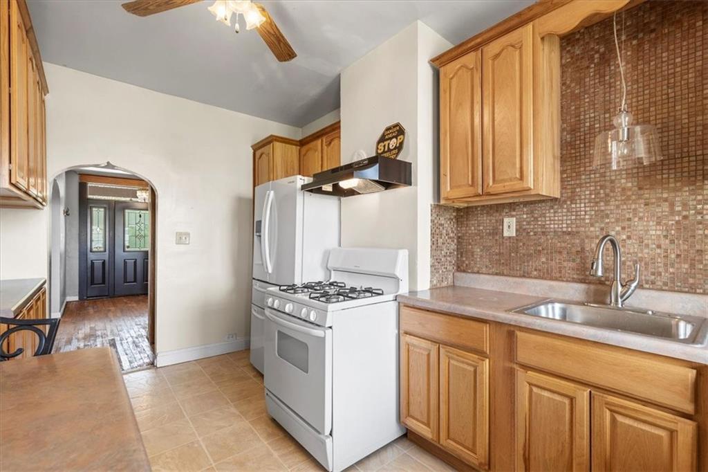 1622 Methyl Street Pittsburgh, PA 15216 - Photo 15 of 45 a kitchen with stainless steel appliances granite countertop a stove a sink and a granite counter tops