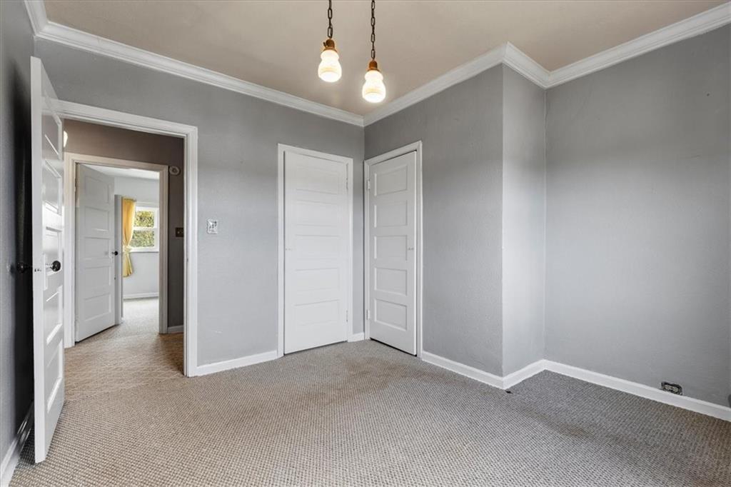 1622 Methyl Street Pittsburgh, PA 15216 - Photo 20 of 45 an empty room with a chandelier fan and windows
