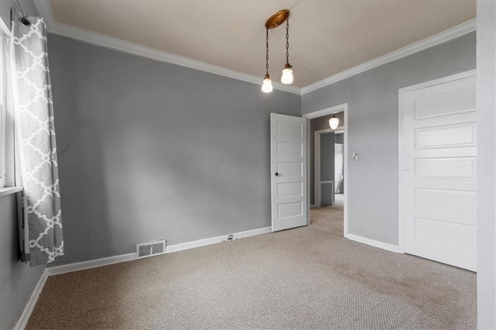 1622 Methyl Street Pittsburgh, PA 15216 - Photo 21 of 45 en empty room with windows and chandelier