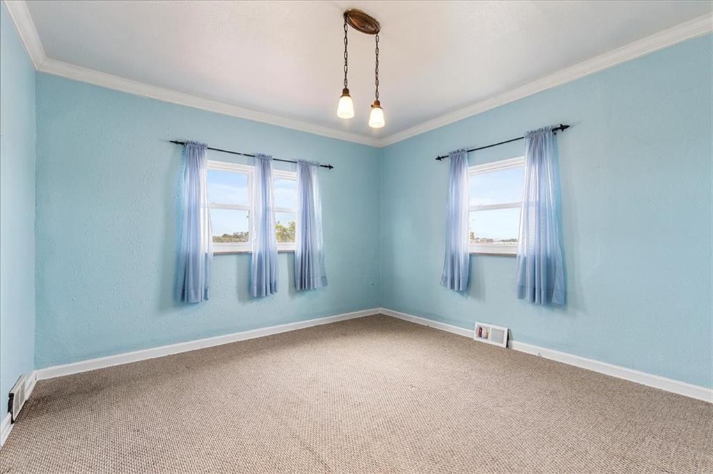 1622 Methyl Street Pittsburgh, PA 15216 - Photo 23 of 45 an empty room with chandelier fan and windows