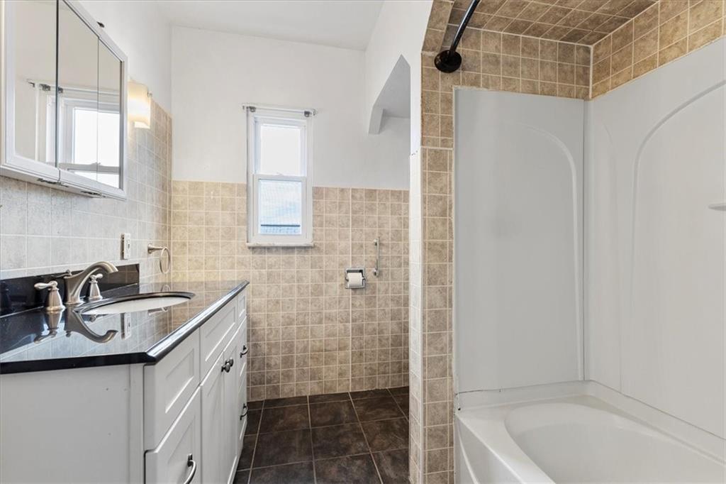 1622 Methyl Street Pittsburgh, PA 15216 - Photo 25 of 45 a bathroom with a sink a toilet and shower