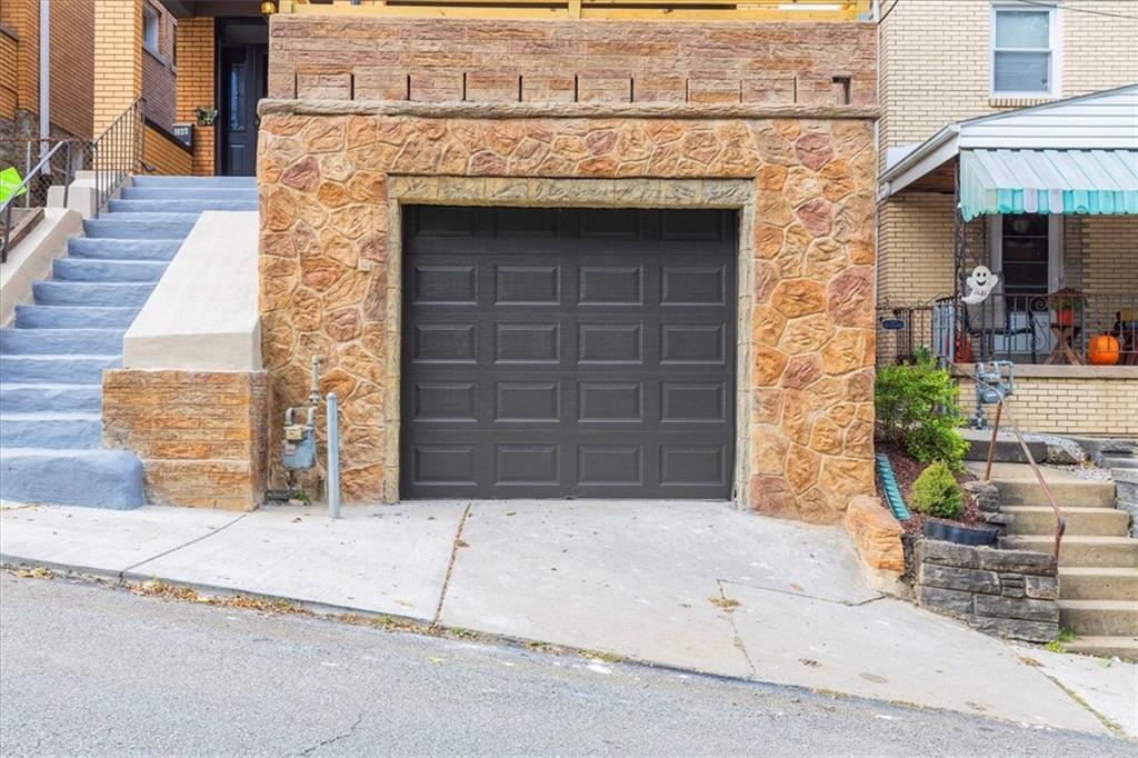 1622 Methyl Street Pittsburgh, PA 15216 - Photo 40 of 45 a front view of a house with garage