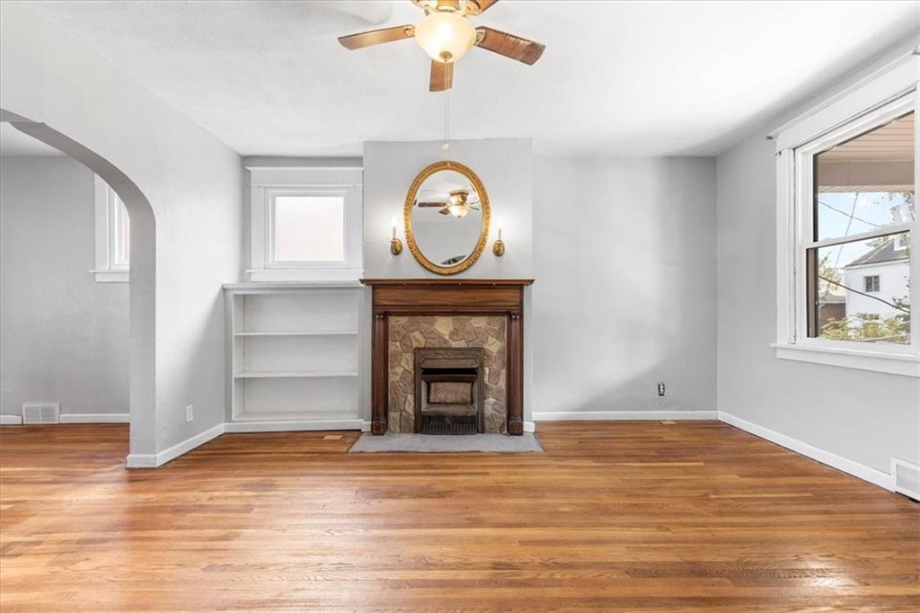 1622 Methyl Street Pittsburgh, PA 15216 - Photo 5 of 45 a view of an empty room with a fireplace and a window
