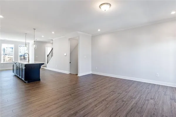 a view of kitchen with furniture and wooden floor