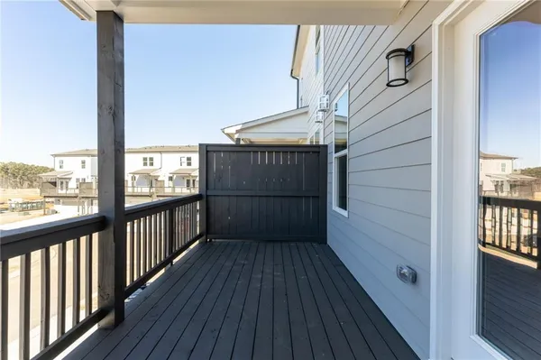 a view of a balcony with wooden floor
