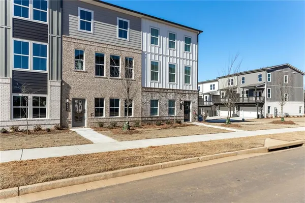a view of a car park in front of house