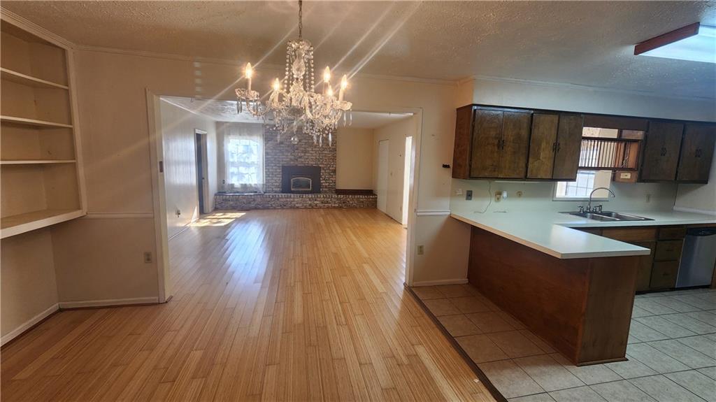 4 Glen View Drive Northeast Rome, GA 30165 - Photo 8 of 18 a large kitchen with stainless steel appliances granite countertop a oven and a wooden floors