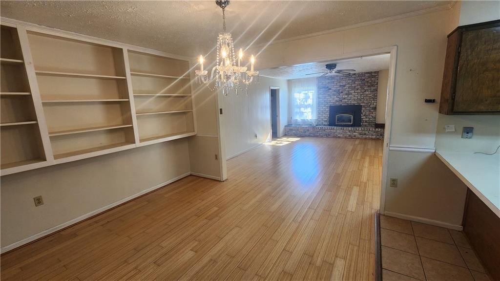 4 Glen View Drive Northeast Rome, GA 30165 - Photo 9 of 18 a view of a room with wooden floor and a kitchen space