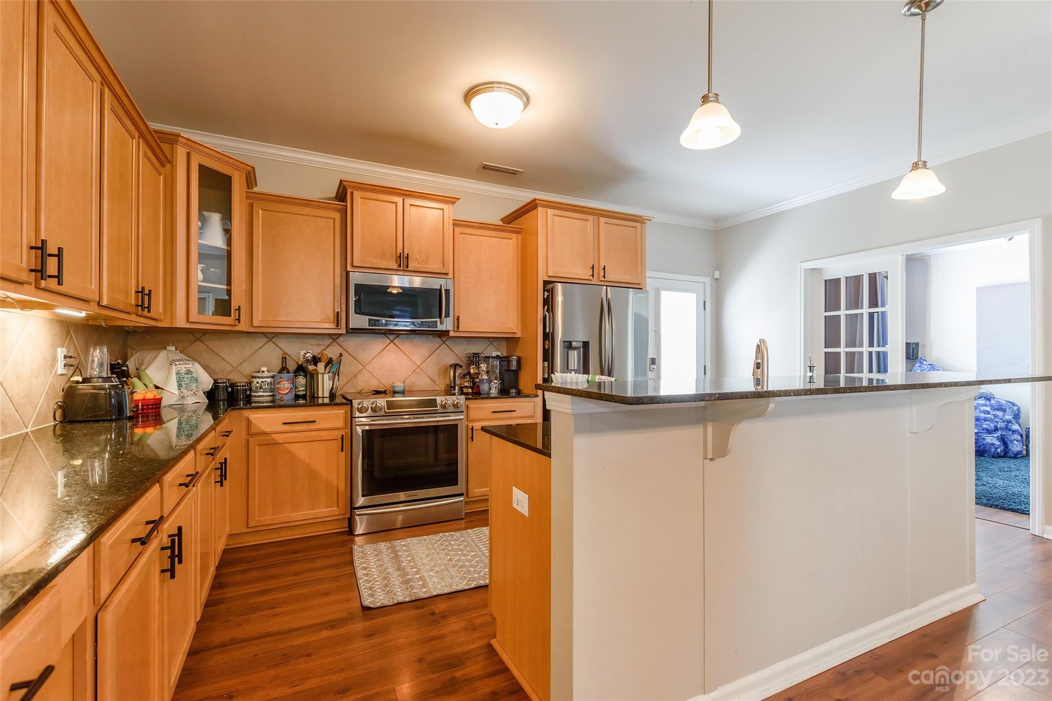 2210 Durand Road Fort Mill, SC 29715 - Photo 8 of 27 a kitchen with stainless steel appliances granite countertop a stove a sink and a refrigerator