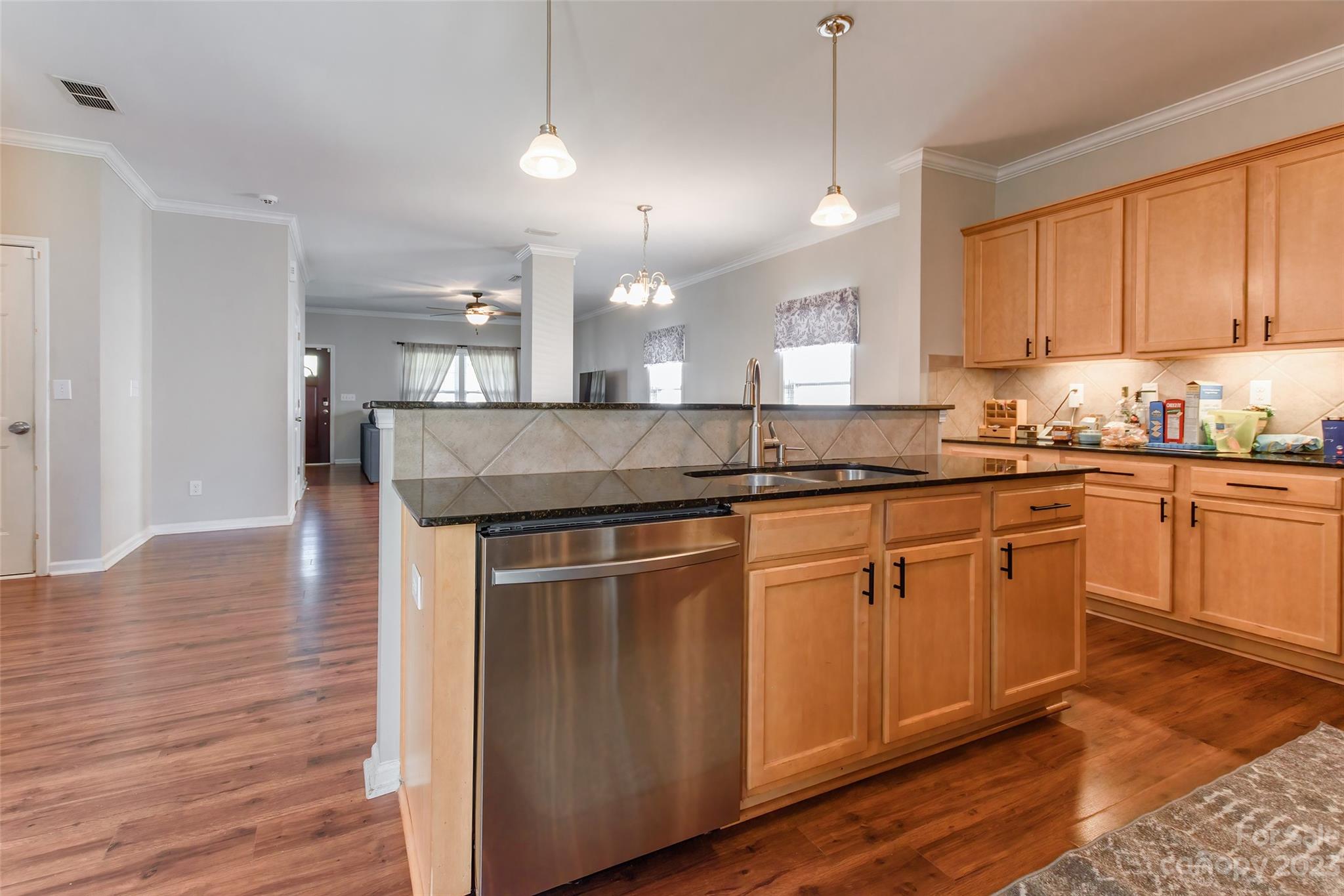 2210 Durand Road Fort Mill, SC 29715 - Photo 10 of 27 a kitchen with stainless steel appliances granite countertop a sink a stove a refrigerator and island with wooden floor