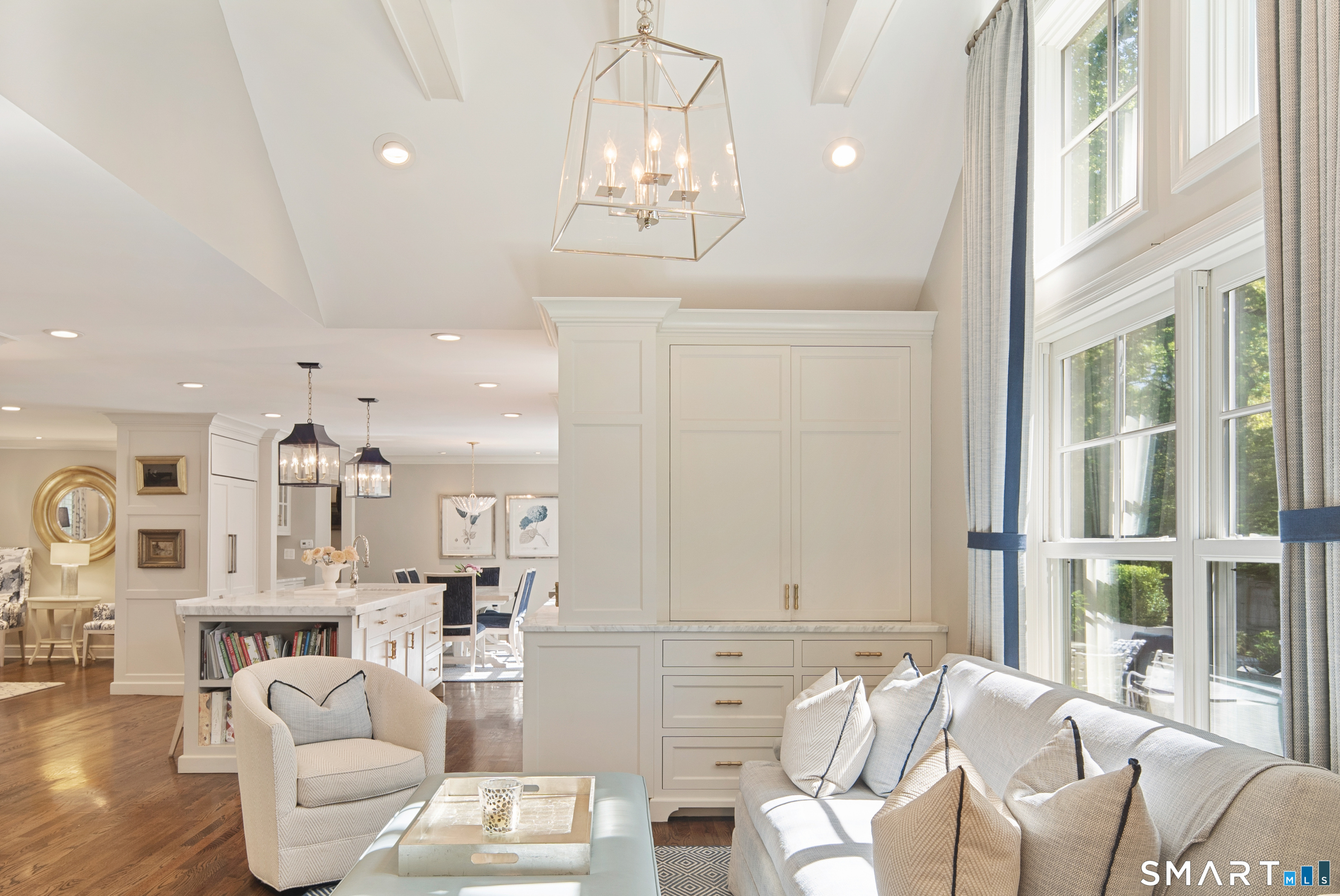 11 McLaren Road South Darien, CT 06820 - Photo 31 of 40 a living room with furniture a chandelier and a dining table