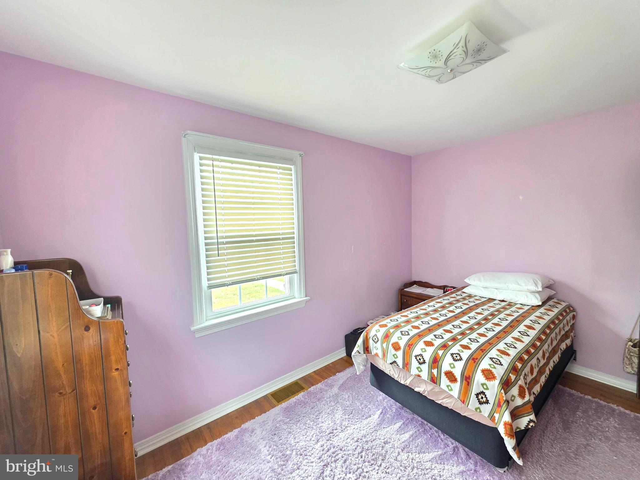 27 George Street Mount Ephraim, NJ 08059 - Photo 15 of 27 a bedroom with a bed and wooden floor