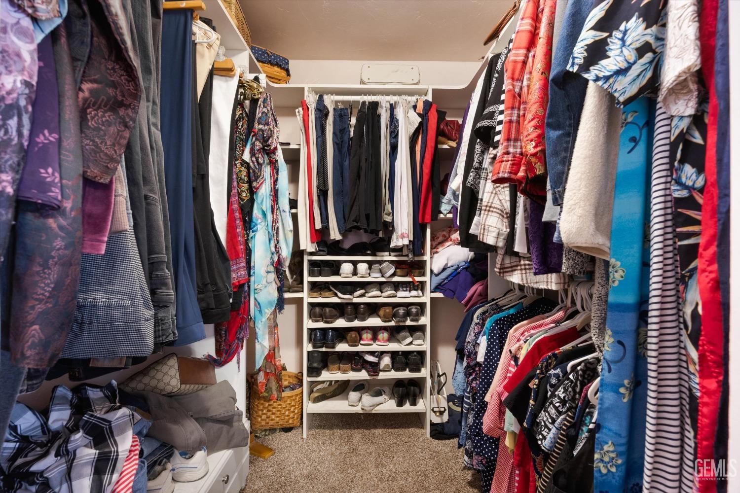Undisclosed Address Bakersfield, CA 93309 - Photo 25 of 43 a view of walk in closet with clothes
