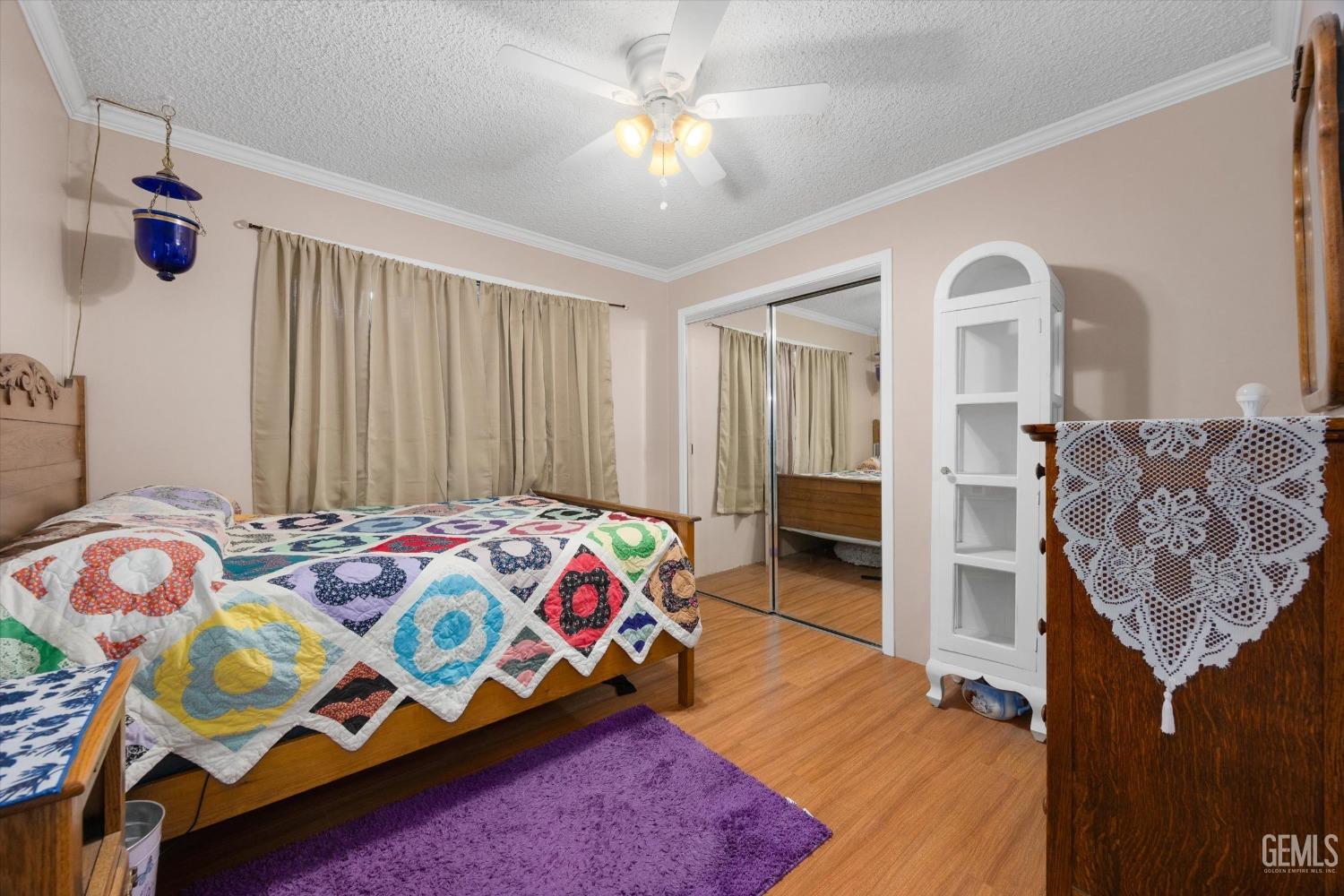 Undisclosed Address Bakersfield, CA 93309 - Photo 26 of 43 a bedroom with a bed and a window