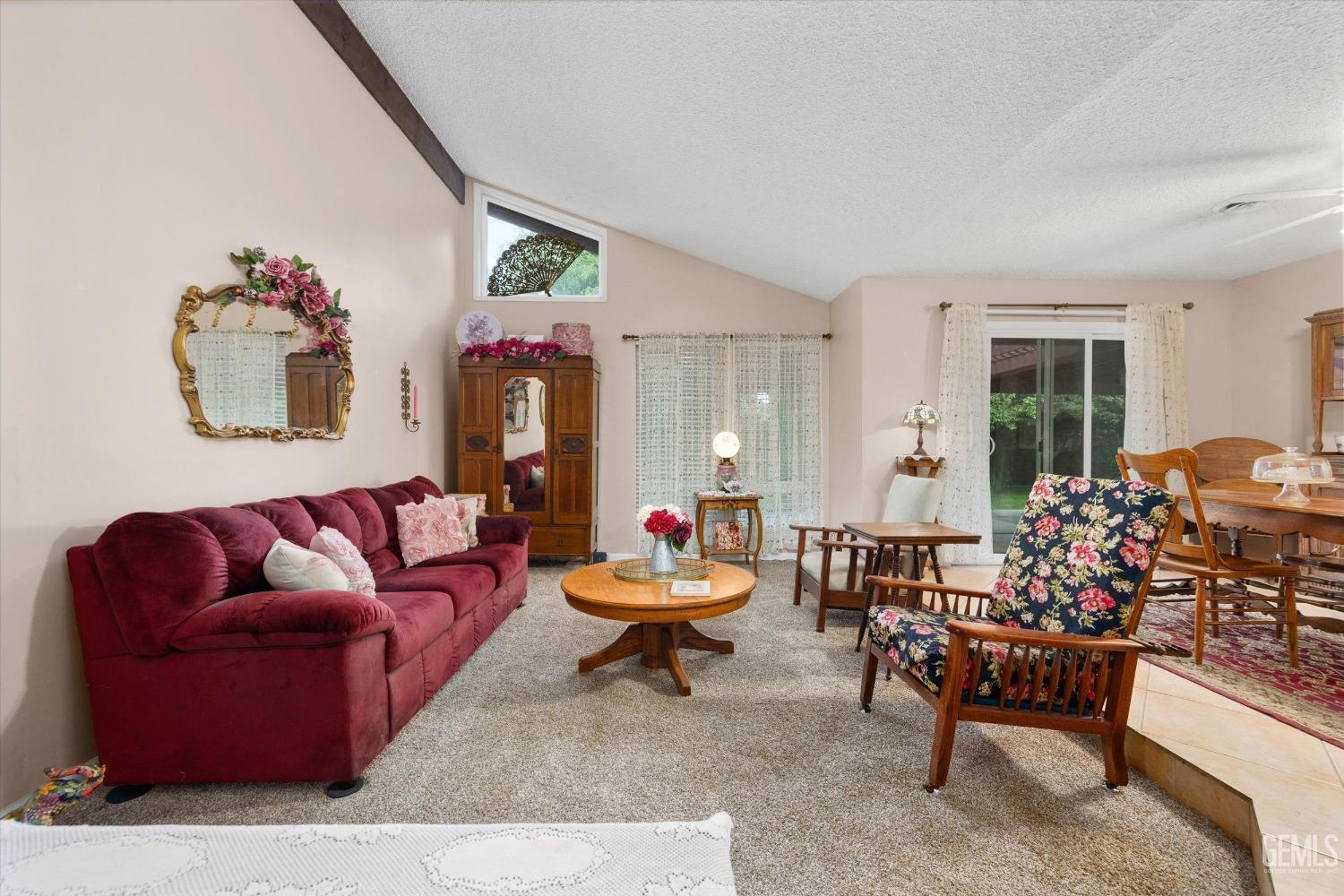 Undisclosed Address Bakersfield, CA 93309 - Photo 5 of 43 a living room with furniture and wooden floor
