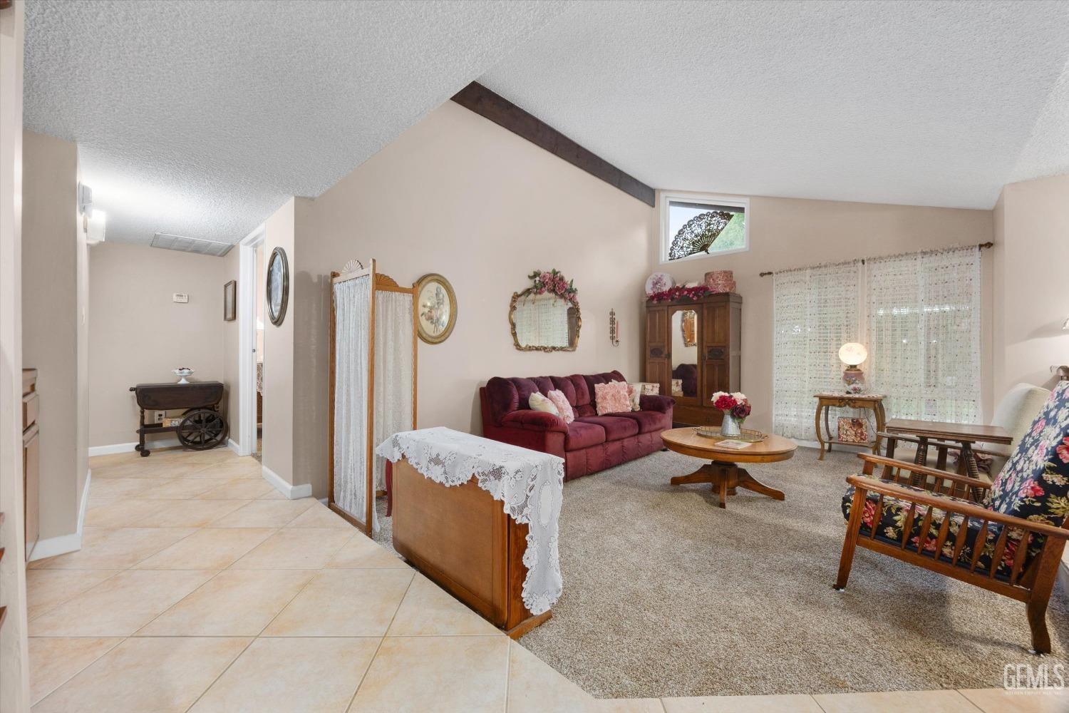 Undisclosed Address Bakersfield, CA 93309 - Photo 6 of 43 a living room with furniture and wooden floor