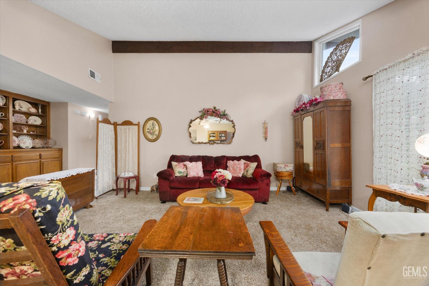 Undisclosed Address Bakersfield, CA 93309 - Photo 8 of 43 a living room with furniture and a flat screen tv