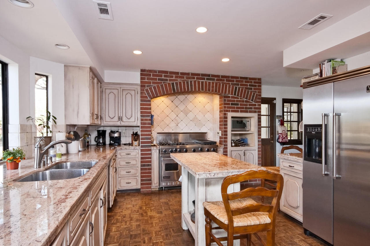 312 Fairview Road Ojai, CA 93023 - Photo 23 of 24 a kitchen with stainless steel appliances granite countertop a sink refrigerator and cabinets