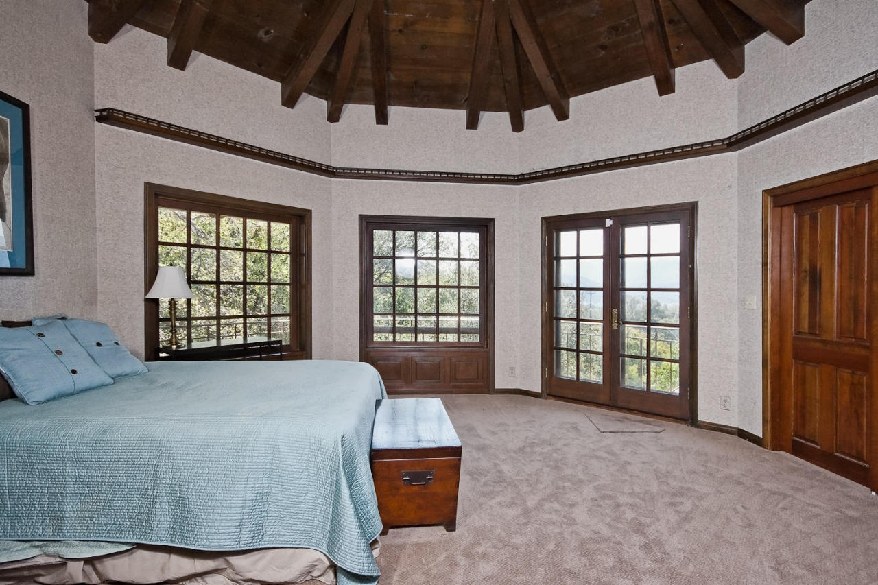 312 Fairview Road Ojai, CA 93023 - Photo 8 of 24 a spacious bedroom with a bed a dresser and windows
