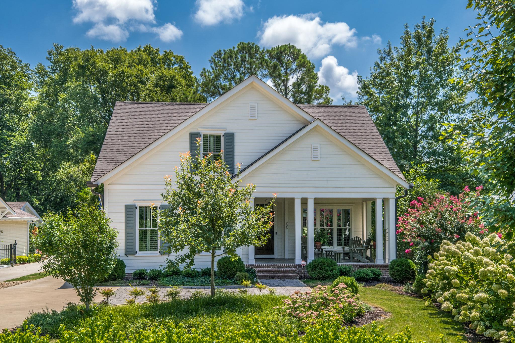 206 Franklin Road Franklin, TN 37064 - Photo 1 of 30 a view of a house with a yard and potted plants