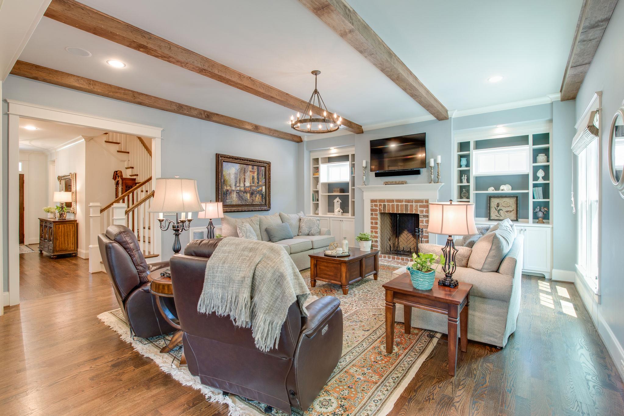 206 Franklin Road Franklin, TN 37064 - Photo 13 of 30 a living room with fireplace furniture and a flat screen tv