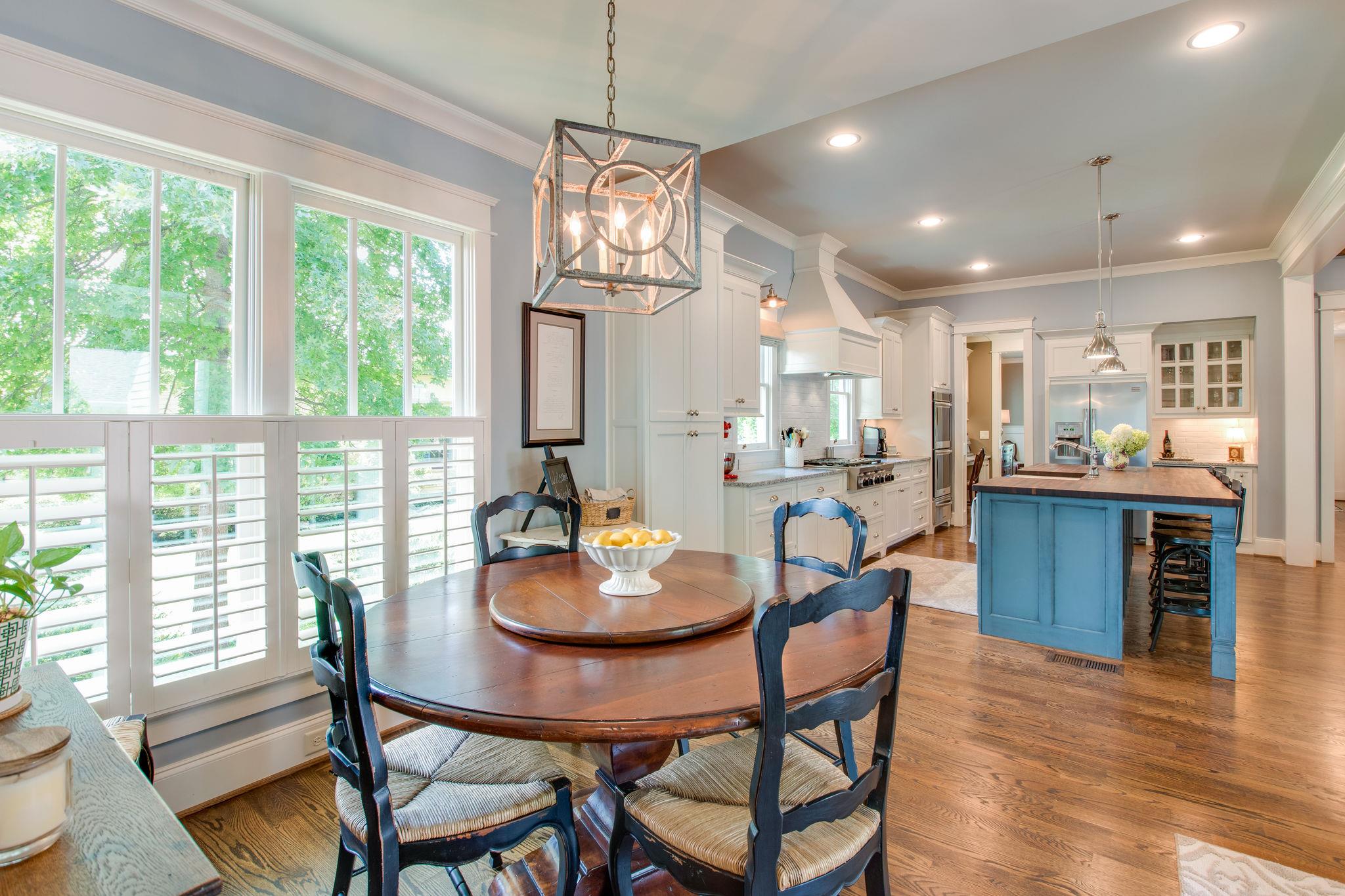 206 Franklin Road Franklin, TN 37064 - Photo 19 of 30 a view of a dining room with furniture large window and wooden floor