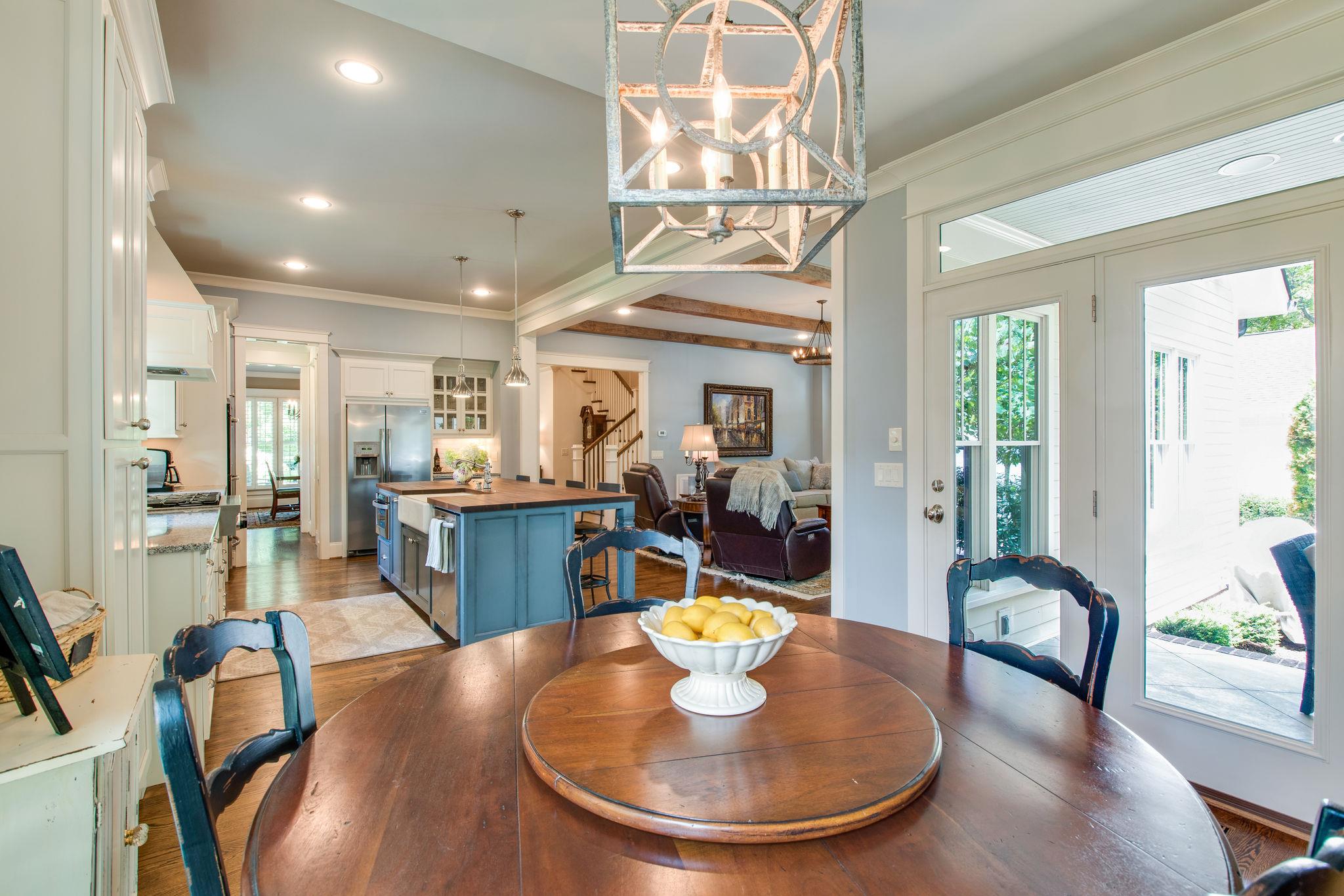 206 Franklin Road Franklin, TN 37064 - Photo 20 of 30 a view of a dining room with furniture a chandelier and wooden floor