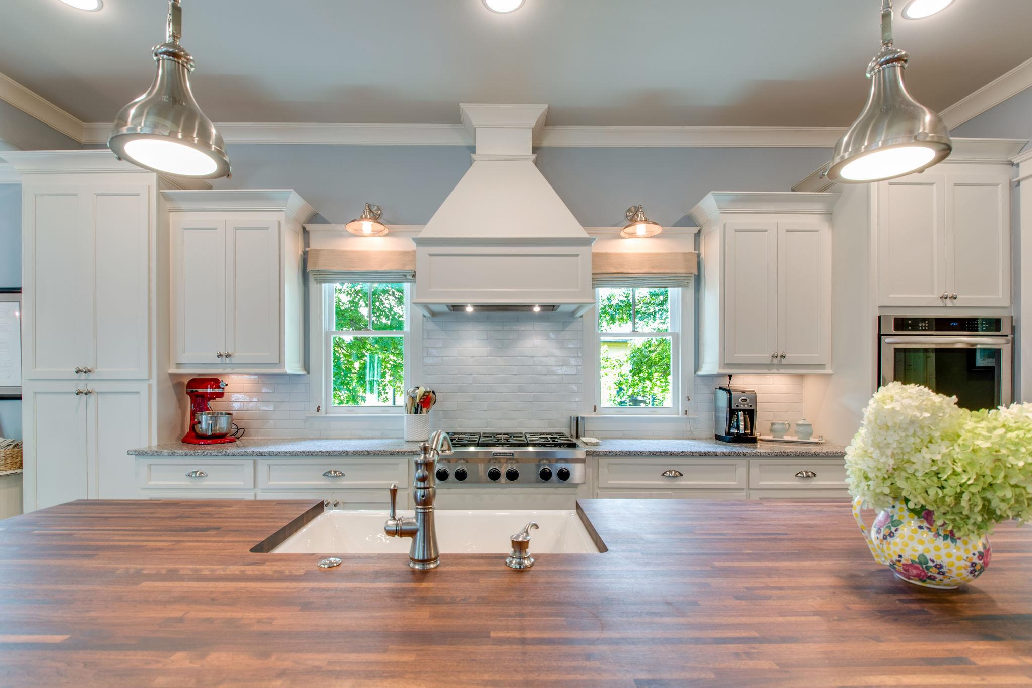 206 Franklin Road Franklin, TN 37064 - Photo 22 of 30 a living room with kitchen island furniture and a fireplace