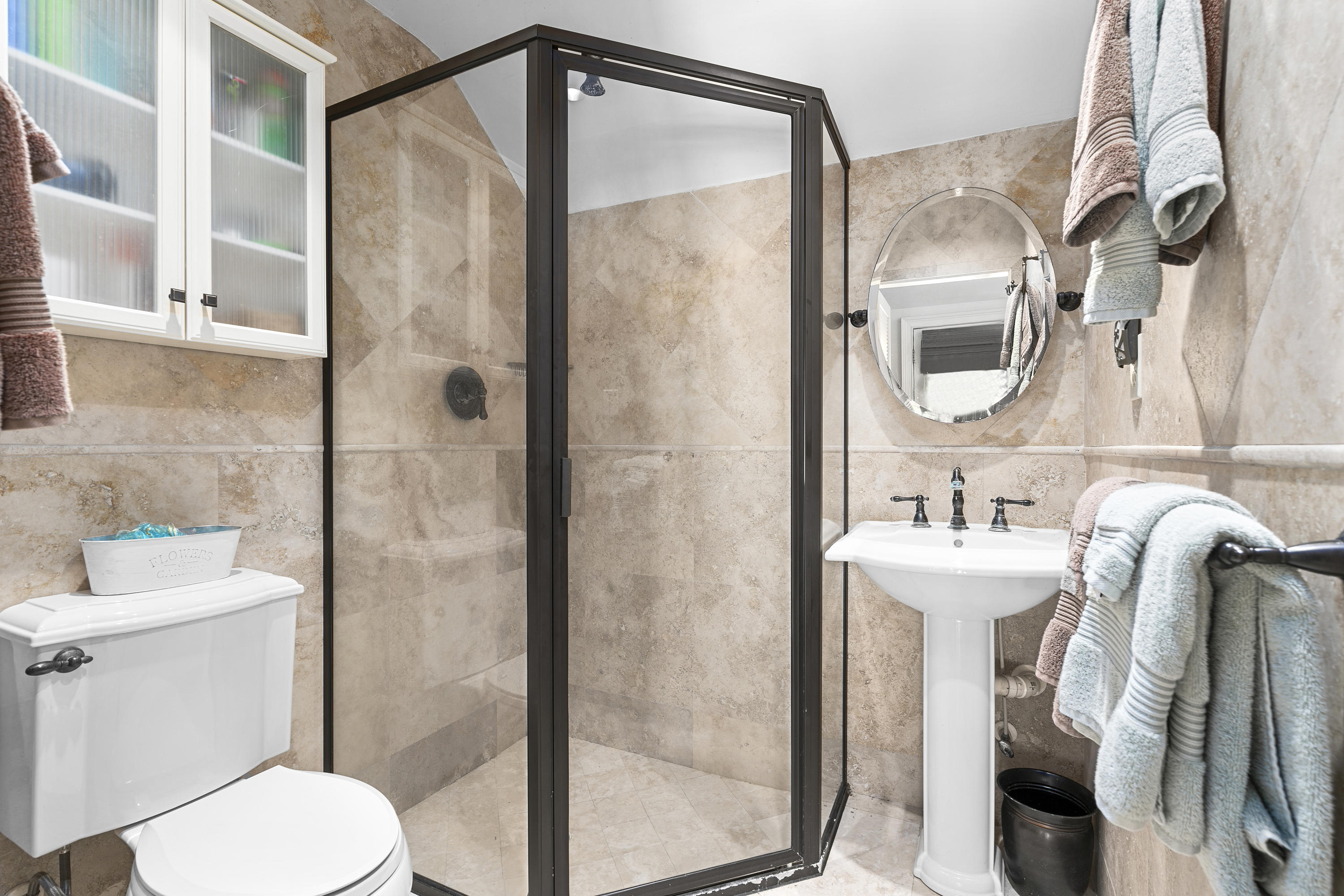 4098 McCarty Road Fort Pierce, FL 34945 - Photo 24 of 38 a bathroom with a sink a toilet and shower