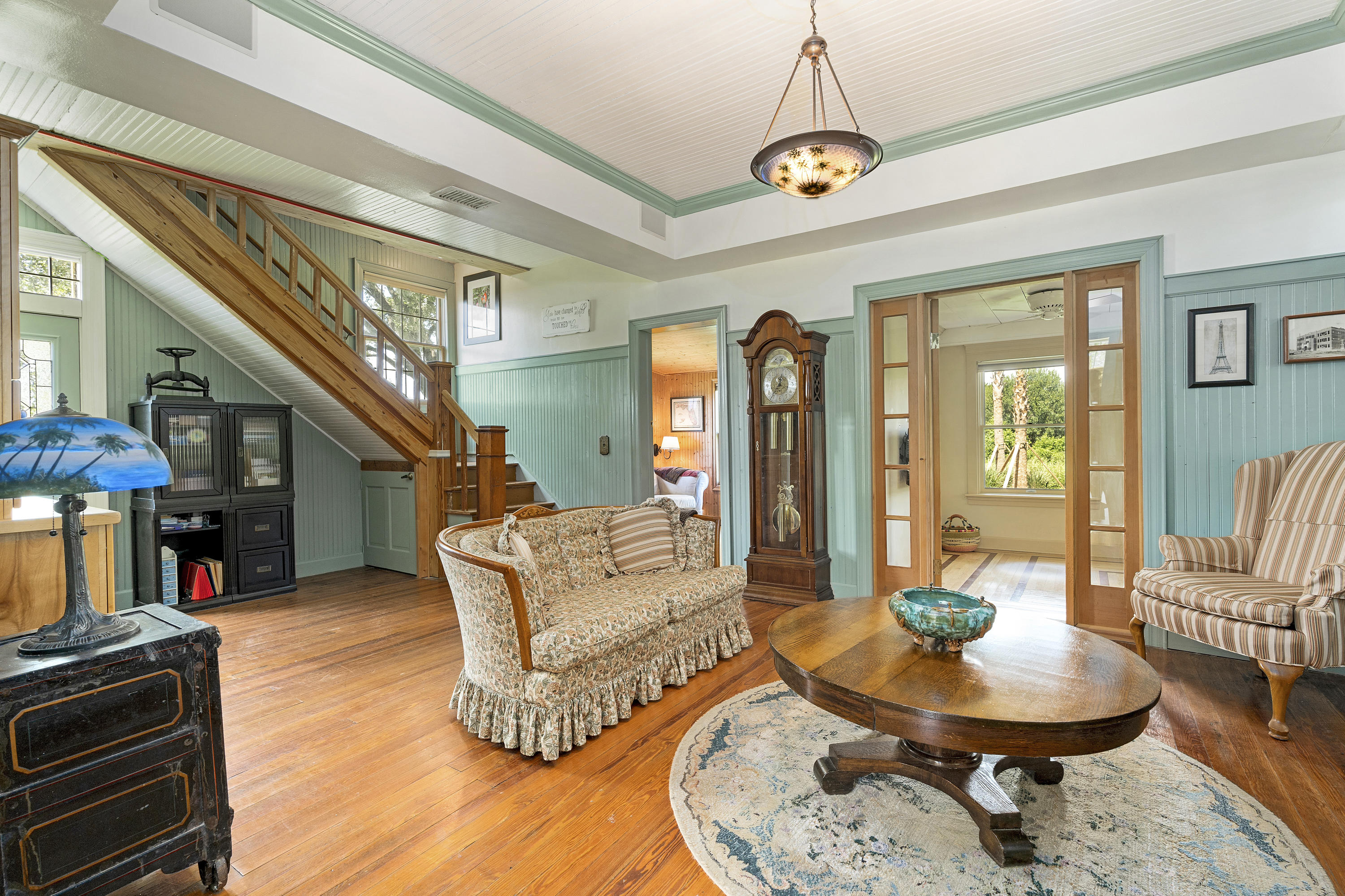 4098 McCarty Road Fort Pierce, FL 34945 - Photo 8 of 38 a living room with fireplace furniture and a chandelier