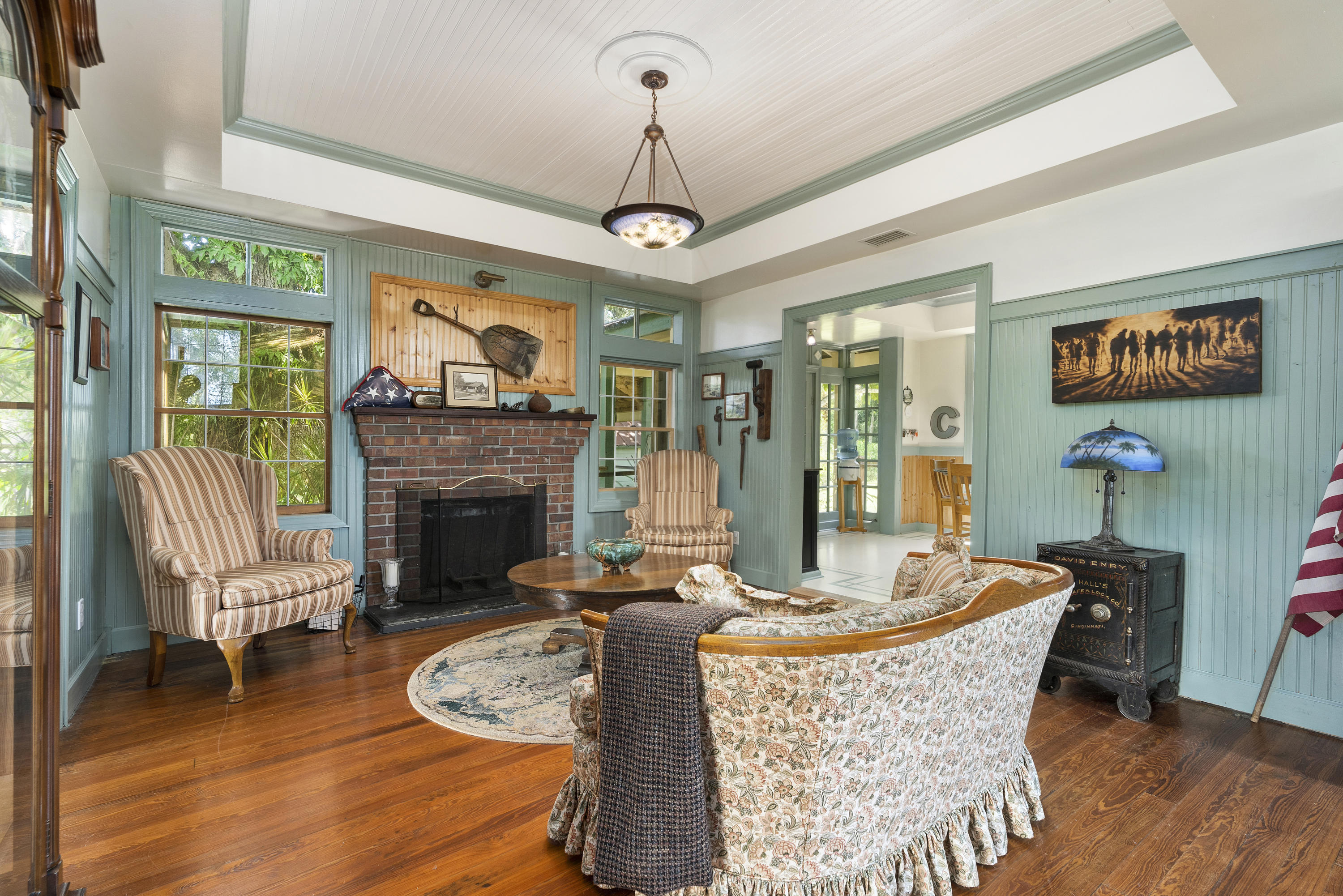 4098 McCarty Road Fort Pierce, FL 34945 - Photo 9 of 38 a view of a dining room with furniture wooden floor and a chandelier