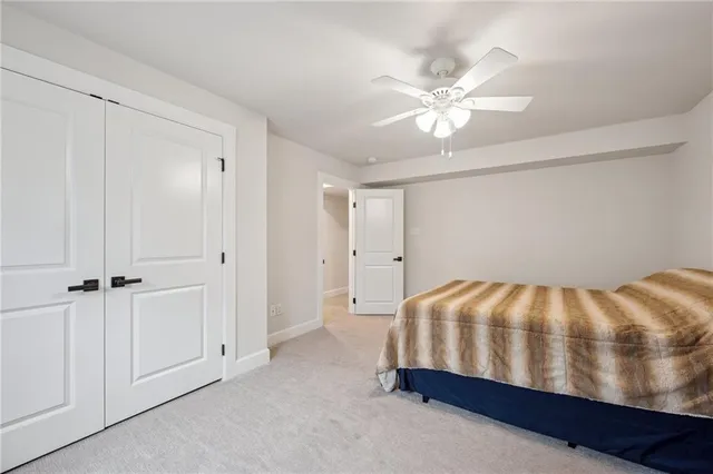 a bedroom with a bed and closet