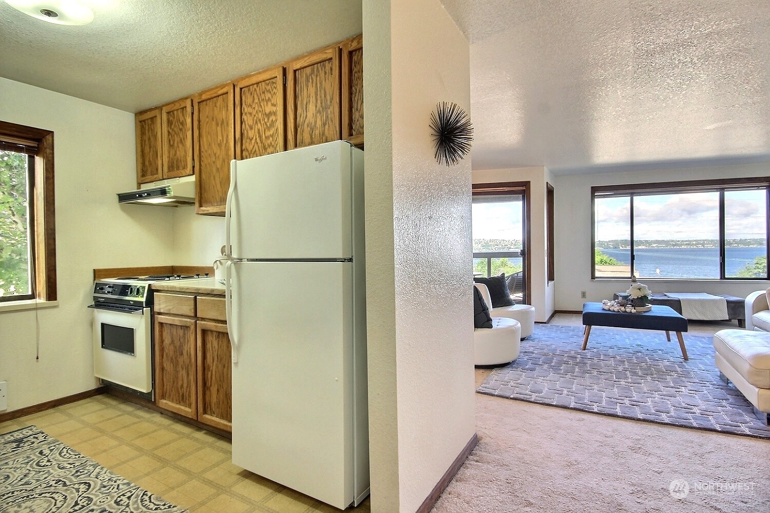740 North 32nd Street, Unit 1 Renton, WA 98056 - Photo 18 of 32 a kitchen with stainless steel appliances granite countertop a refrigerator and a stove